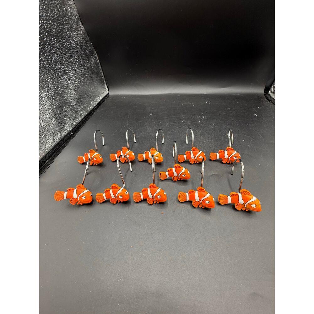 shower curtain hooks featuring clownfish, strongly resembling the character Nemo